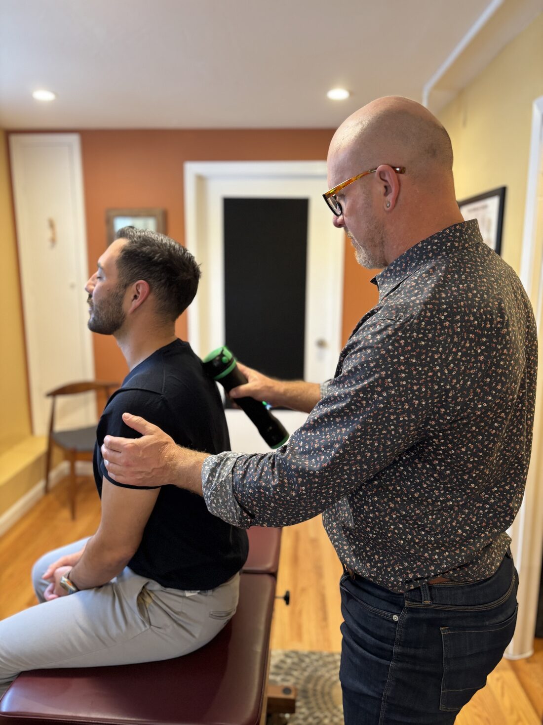Dr. Cameron Quillian treating a patient at SF City Chiropractic